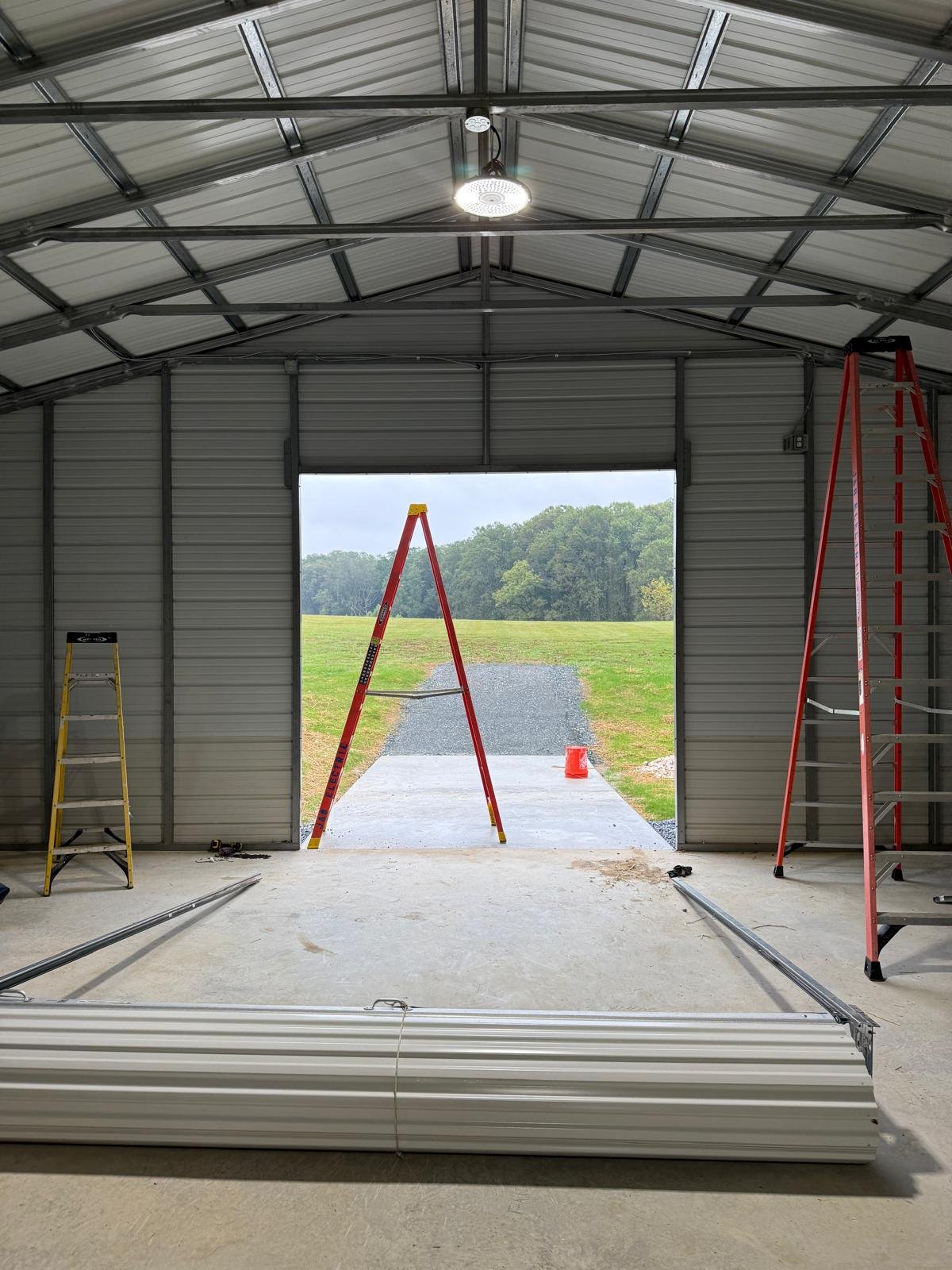 Technician inspecting a noisy residential garage door